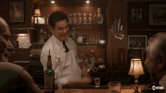 a bartender prepares a shot in front of a sign that says showtime
