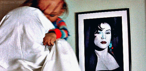 a picture of a woman is framed on a wall next to a person