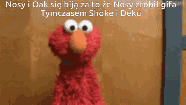 elmo from sesame street is standing in front of a wooden wall