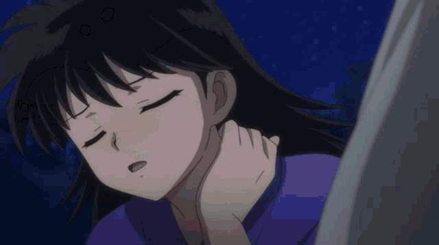 a girl with black hair and a purple shirt is sleeping