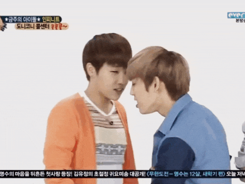 two young men are kissing on a tv screen that says eyec