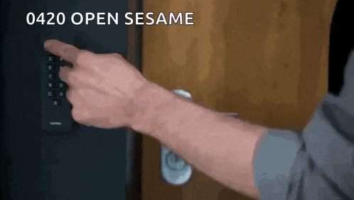 a person is pressing a button on a door that says 0420 open sesame