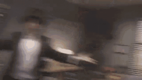 a blurry picture of a room with smoke coming out of a window