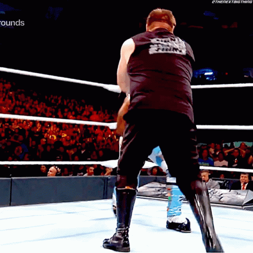 Kevin Owens Stunner GIF - Kevin Owens Stunner Xavier Woods GIFs