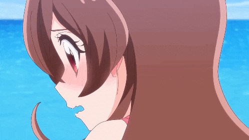 a close up of a girl 's face with her mouth open