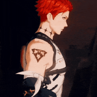 a man with red hair has a tattoo of a triangle on his arm that says ' warrior '
