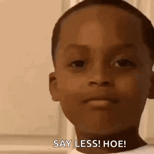 a little boy is making a funny face and saying `` say less ! hoe '' .
