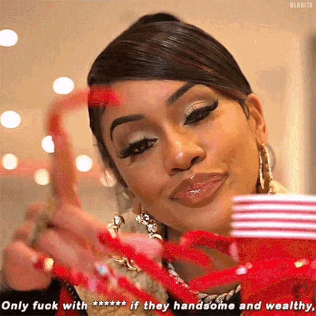 a woman with long red nails says only fuck with *** if they handsome and wealthy ..