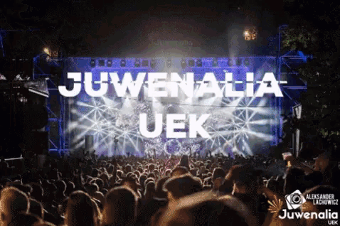 a crowd of people watching juvenalia uek at a concert
