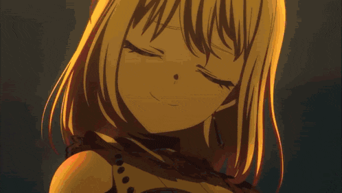 a close up of a girl 's face with red eyes