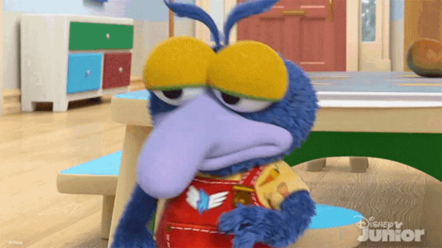 a stuffed animal with a disney junior logo on the bottom