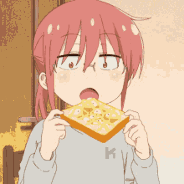 a girl with pink hair is holding a piece of toast with butter on it .