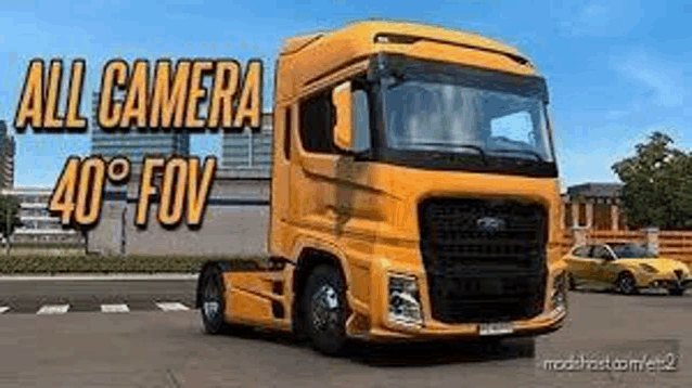 a yellow semi truck is parked on the side of a road .