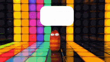 a cartoon worm is standing in front of a wall of colorful blocks