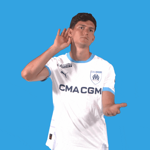 a man wearing a white shirt with cma cgm on the front