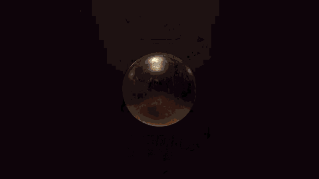 a dark background with a light coming out of the bottom