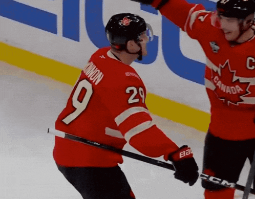 a hockey player in a red jersey with the number 9 on it