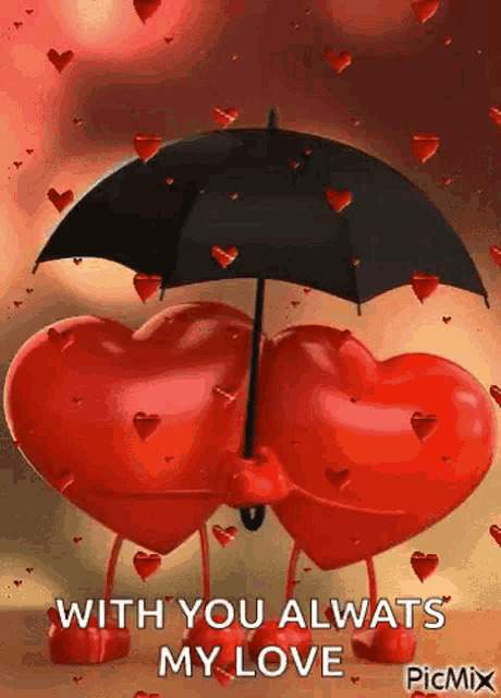 a couple of red hearts holding an umbrella .