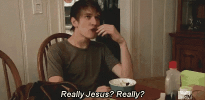 a man is sitting at a table with a bowl of cereal and says really jesus really ?