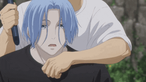 a man with blue hair is holding another man 's head