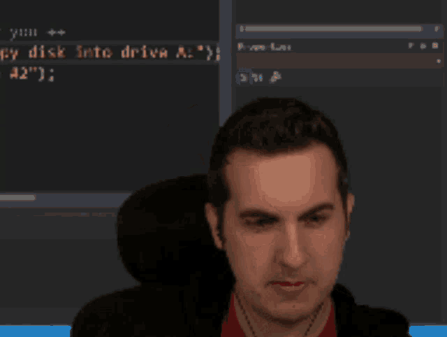a man is smiling in front of a screen that says ' you '