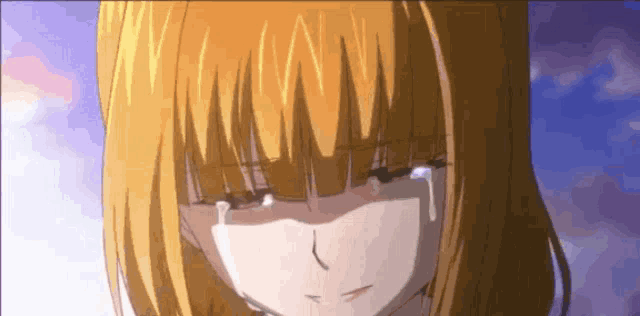 a girl with blonde hair is crying with tears coming down her face