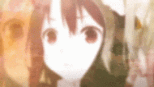 a close up of a anime girl 's face with a blurred background .