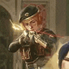 a man in a beret is holding a gun in a room .