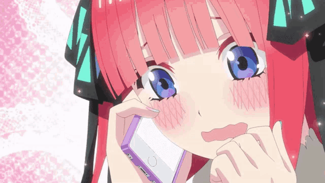 a girl with pink hair and blue eyes is talking on a phone