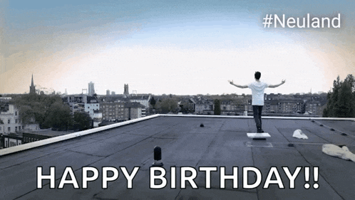 a man standing on top of a roof with the words happy birthday