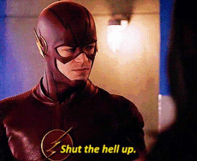 a man in a flash suit is saying shut the hell up