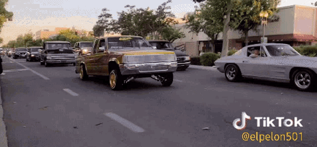 a group of cars are driving down a street with a tiktok watermark on the bottom right