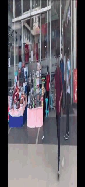 a store front with a sign that says coca cola on it