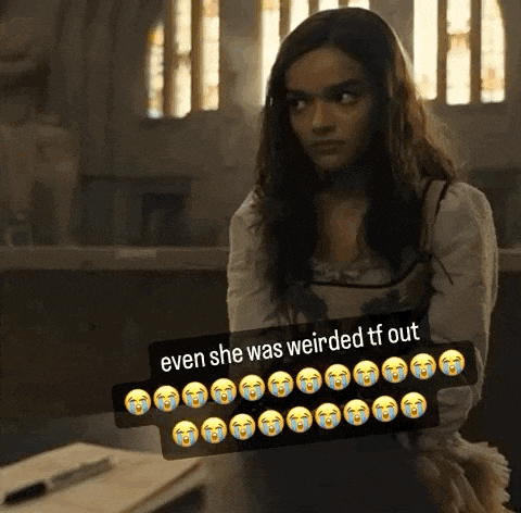 a woman is standing in front of a window with a sticker that says even she was weirded tf out