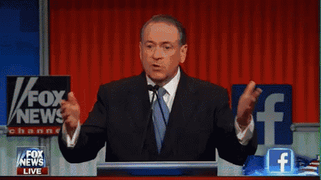 a man stands at a podium in front of a screen that says illegals prostitutes pimps and fox news live