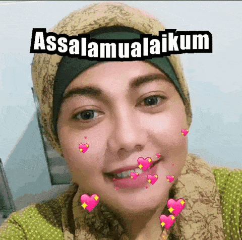 a woman wearing a hijab and scarf is smiling with hearts around her face and the words assalamualaikum on her face .