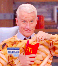 Anderson Cooper Eats Fries Like Popcorn GIF - Popcorn Fries Mcdonalds GIFs