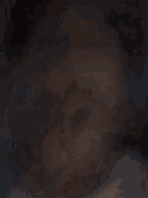 a dark background with a lot of smoke coming out of it .