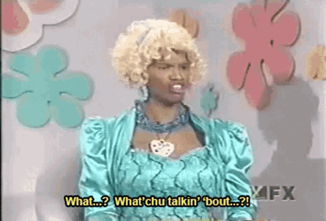 a woman in a blue dress is saying what chu talkin ' bout