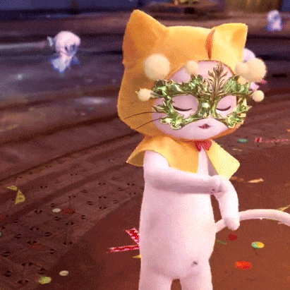a cat wearing a yellow cape and green mask