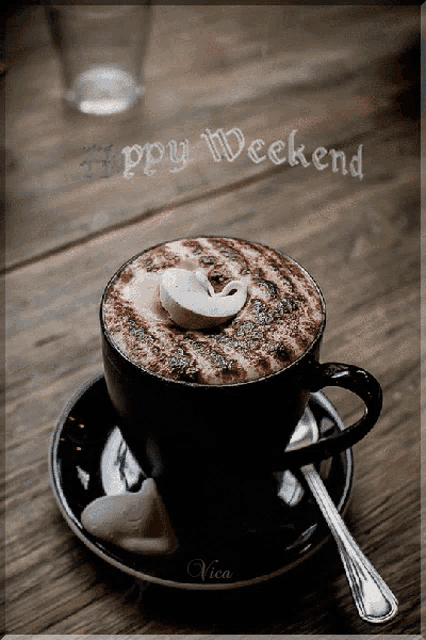 a cup of coffee on a saucer with the words happy weekend