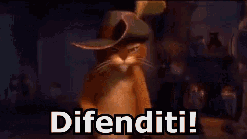 a cat wearing a hat is standing in front of a sign that says difenditi !