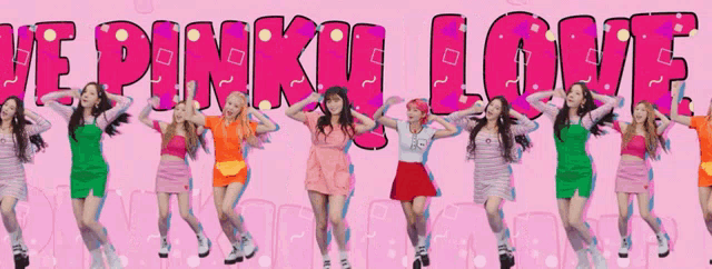 a group of girls are dancing in front of a sign that says we pinky love