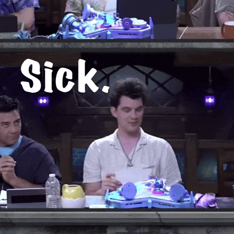 a man sitting at a table with the word sick written on it