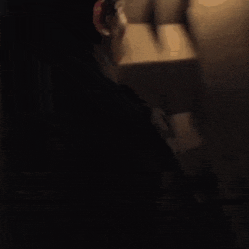 a woman in a fur coat is walking through a doorway