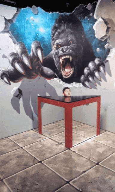 a painting of a gorilla with sharp claws on a wall behind a table
