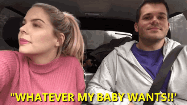 a man and a woman in a car with the words " whatever my baby wants " on the bottom