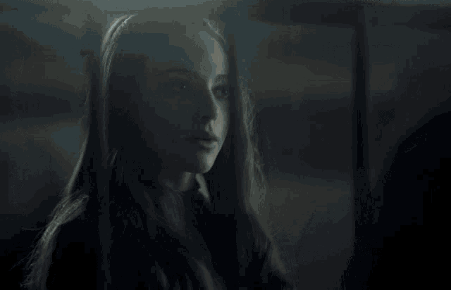 a woman in a dark room with the words produced by bonnie weis on the bottom