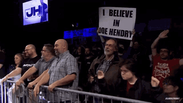a group of people holding up signs that say i believe in joe hendry