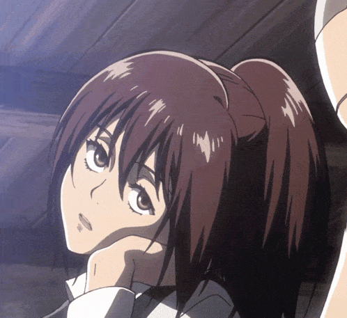 a close up of a girl with a ponytail looking up